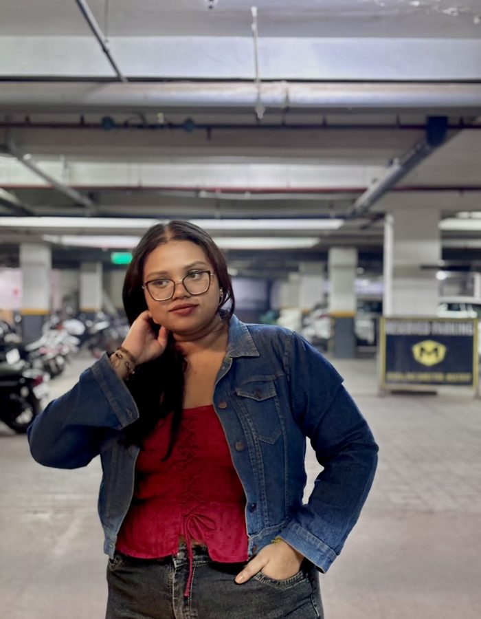 Payel posing in a denim jacket