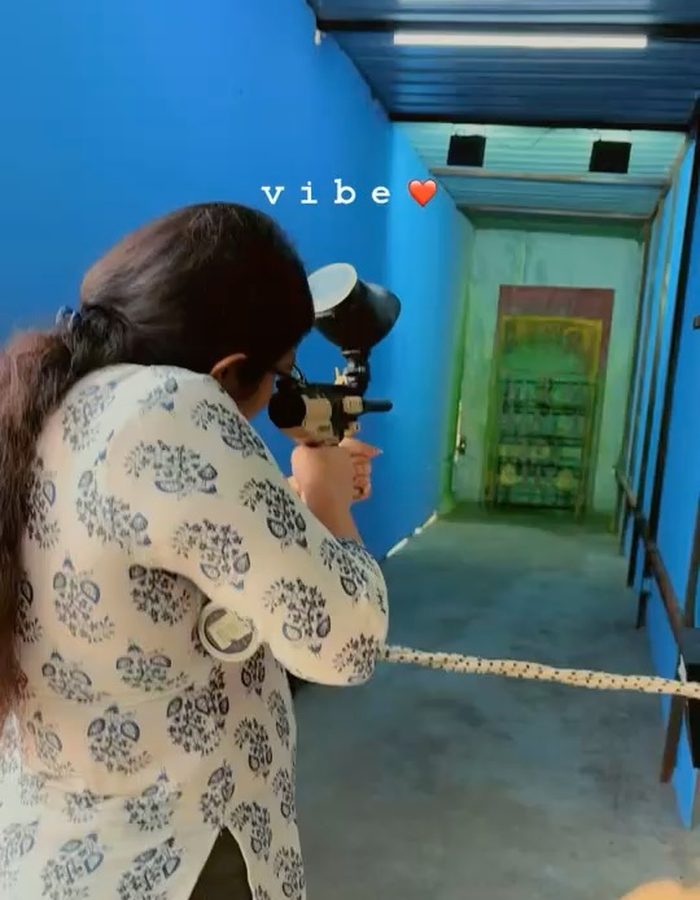 Payel in a bright blue corridor